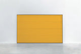 Garagentor Stucco Colore RAL 1021 Rapsgelb – leuchtend gelbe Oberfläche mit Stucco-Struktur