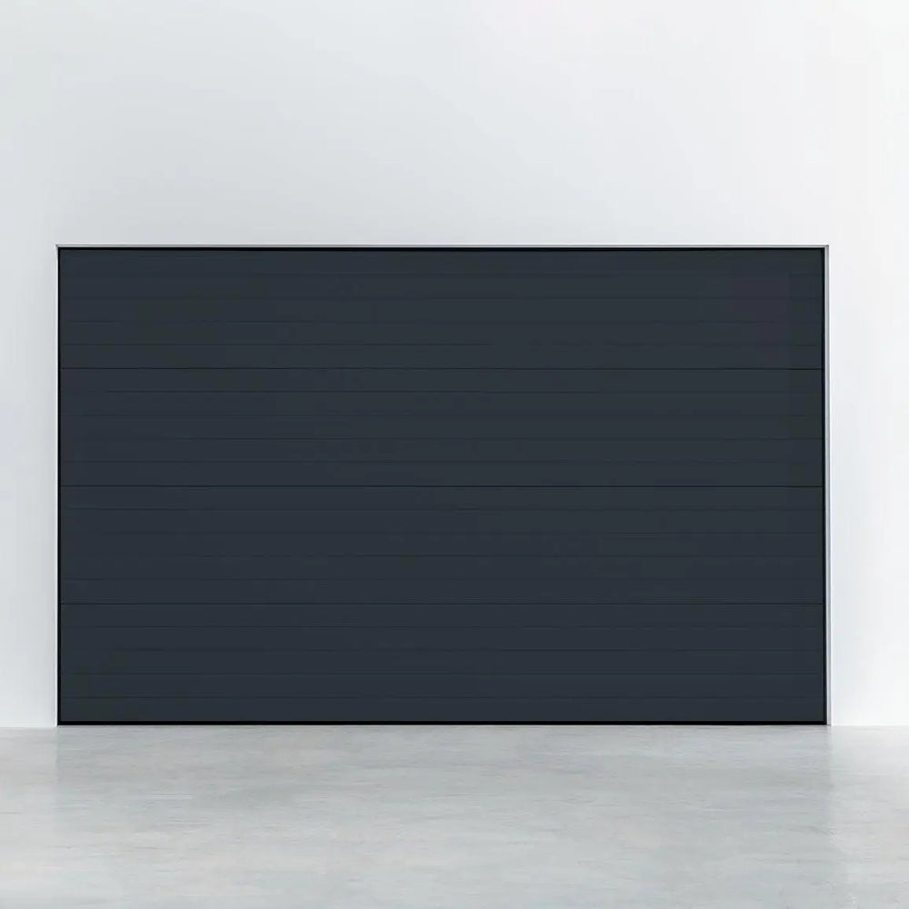 Garagentor Stucco Colore Schwarzgrau – stilvolle Außenansicht mit strukturierter Oberfläche in RAL 7021